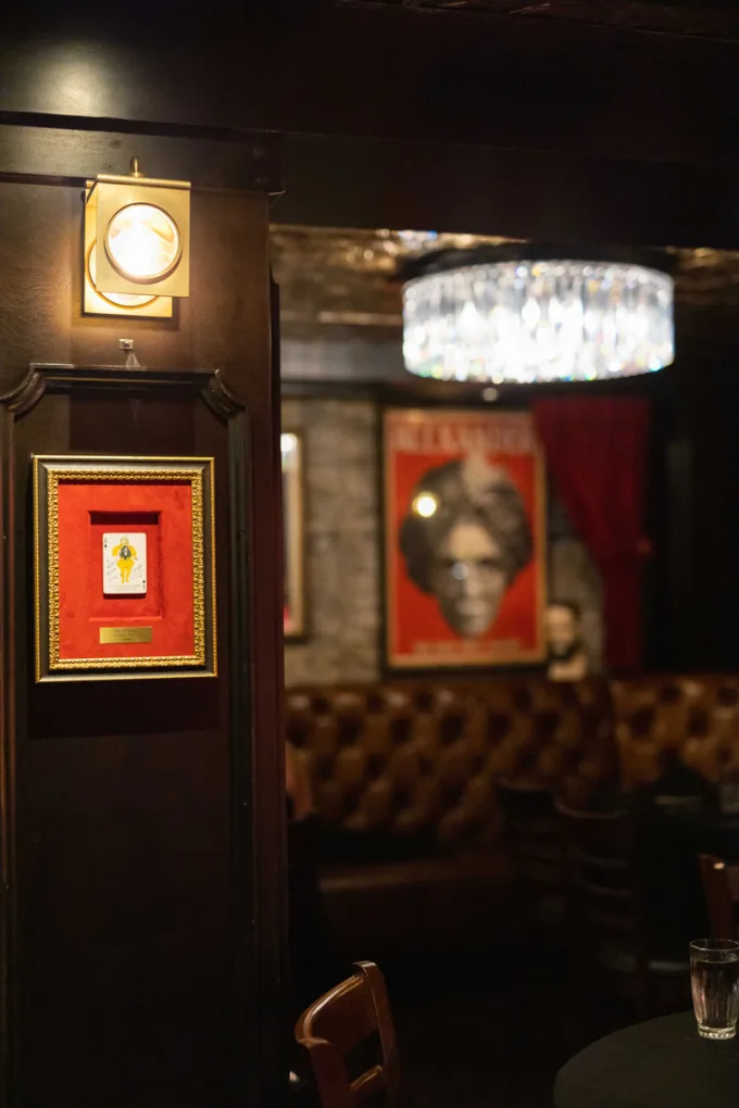 Tufted booths and framed art at House of Cards